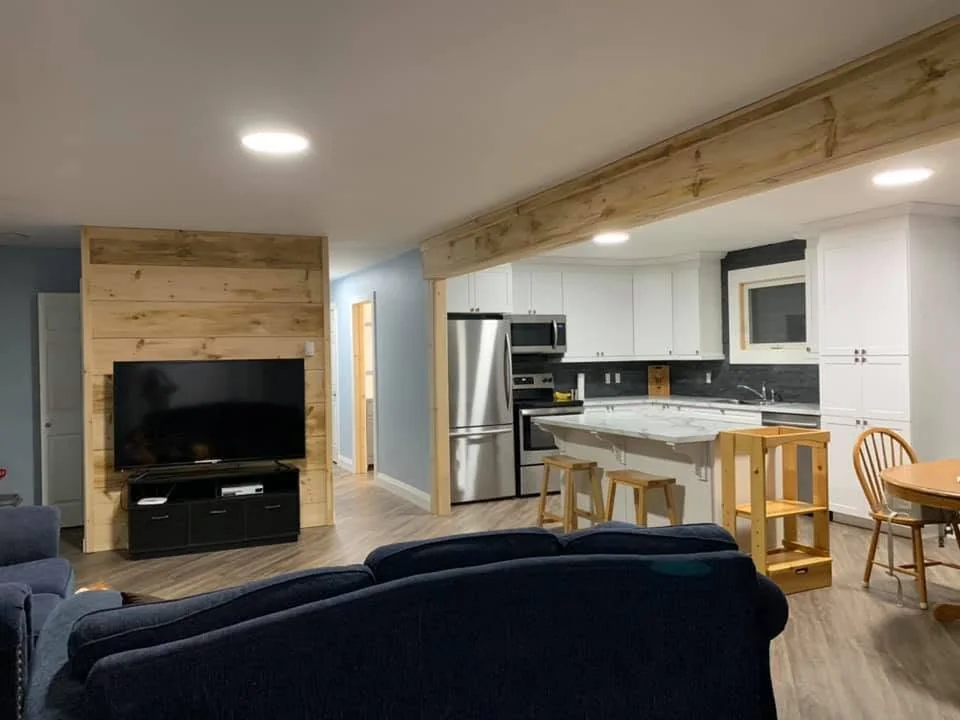 Finished open concept kitchen and living room by CKThompson Contracting